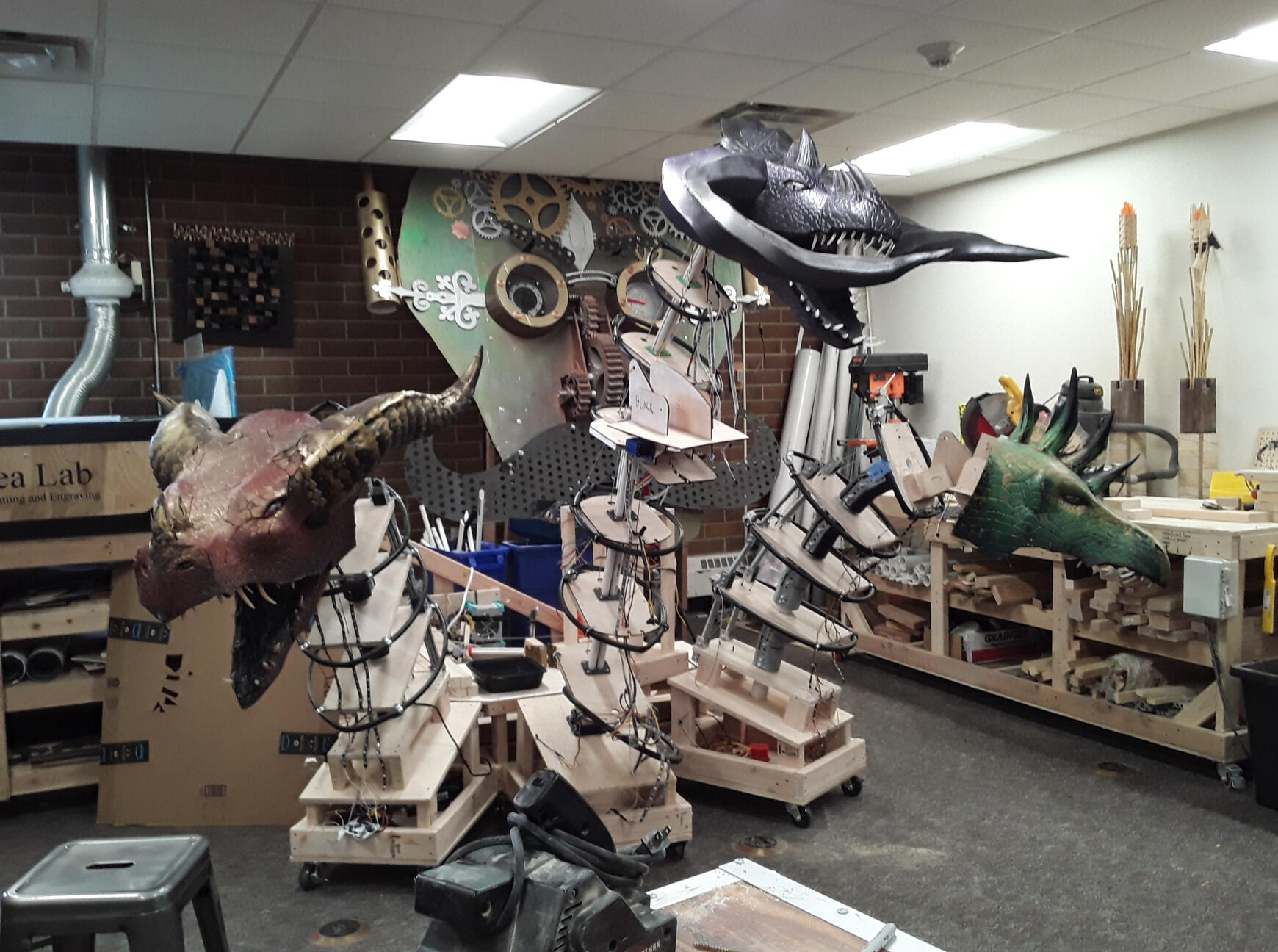 Three of the dragon heads are mounted on the final armature design in the idea lab, and has yet to be skinned.